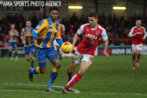 Jean-Louis Akpa Akpro of Shrewsbury Town and Tyler Forbes of Fleetwood Town