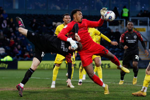 Rob Street of Shrewsbury Town and Jordan Amissah of Burton Albion..