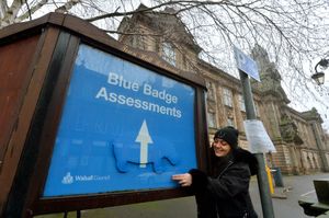 Mellissa Dubovecka, from Walsall, discovers the Hippo hidden in a blue sign outside the Council House. 