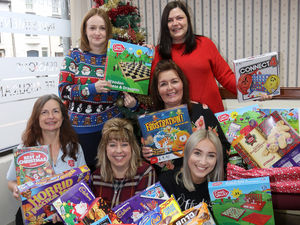 Supporting image for story: Festive hampers donated to charity