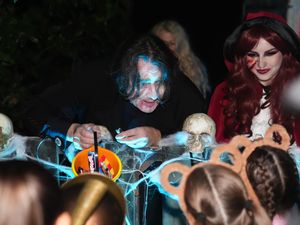 Jonathan Ross outside his house in north London with trick-or-treaters