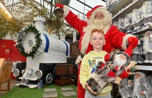 Thomas Michael Carter, 6, with Santa