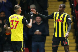 Abdoulaye Doucoure (right) celebrates scoring with team-mate Roberto Pereyra