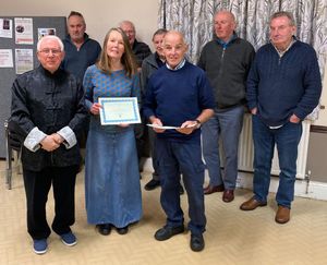 Rebecca Greenham and John Evans receive their Community Awards from Cllr Martin Bennett