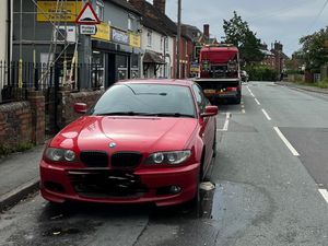 Supporting image for story: Red BMW taken off the streets by police for 'no tax or insurance'
