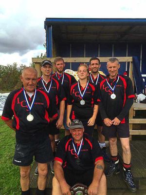 Last Chance Saloon showing off their gold medals