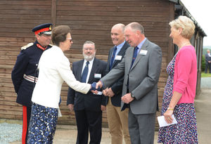 STAFFS PIC  COPYRIGHT DAVID HAMILTON  EXPRESS AND STAR PIC 11/7/14 Her Royal Highness the Princess Royal, during her visit at South Staffordshire Sailing Club, Gailey, greeted by (centre left-right) RYA Council member and chairman of RYA West Midlands Region Mike Kelly, past commodore South Staffordshire Sailing Club Neil Hawkins, commodore Martin Warburton, and Claire Warburton.
