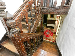 An elaborately carved dog-leg staircase. Photo: Savills/Zoopla
