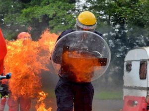 Supporting image for story: See what it's like to be engulfed by flames from a petrol bomb: We try out police riot training