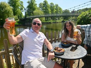 Daz Harper from West Brom and Helen Maxfield from Darlaston enjoying Wednesday's warm weather at the Boathouse, Shrewsbury. Photo: Steve Leath