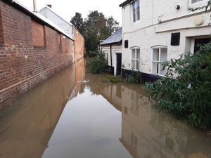 Supporting image for story: Photos show flood water remaining in Shrewsbury and Bridgnorth with warnings still in place