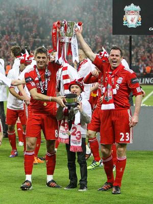 2012: Liverpool's Jamie Carragher and Steven Gerrard celebrate with the Carling Cup trophy