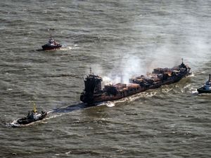 Tug boats shadow the Solong container ship as it drifts in the Humber Estuary, off the coast of East Yorkshire, following a collision with the MV Stena Immaculate oil tanker