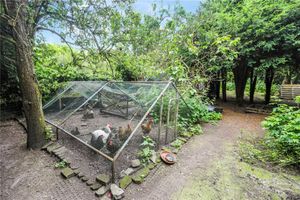 A chicken run features in the garden alongside a pond, picture via: Nock Deighton and Rightmove