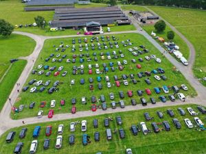 Supporting image for story: Music lovers headbanging in their hatchbacks at drive-in gig