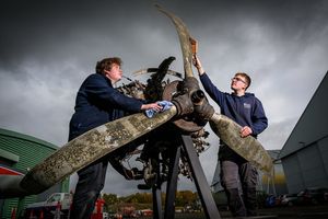 RAF Museum apprentices with engine and propeller