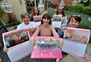 Front centre, Sam Chatwin with, from left, Lynn Purewal, Abbie Crump, Stacey Morgan and 
Sue Banner with their copies of the Calendar Wenches 2023 calendar created for charity
