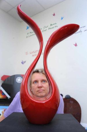 Andrea with modern design urn for cremated ashes