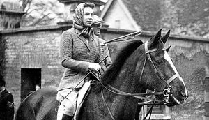April 1959 and the Queen returns from a morning ride at Badminton, Gloucestershire, where she was attending the Badminton Horse Trials
