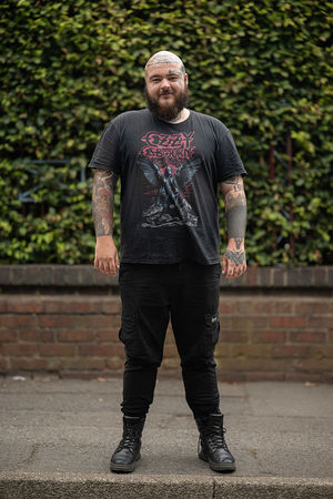 Music fan Arran Pearce arrives to attend British rock band Black Sabbath's "Back to The Beginning" concert, Ozzy Osbourne's final ever gig as Black Sabbath's frontman at Villa Park in Birmingham, central England on July 5, 2025. Osbourne, who revealed in 2020 that he has Parkinson's disease, will join Tony Iommi, Geezer Butler and Bill Ward for the all-day "Back To The Beginning" show in Birmingham, central England, where the heavy metal giants formed in 1968. (Photo by Oli SCARFF / AFP) (Photo by OLI SCARFF/AFP via Getty Images)          