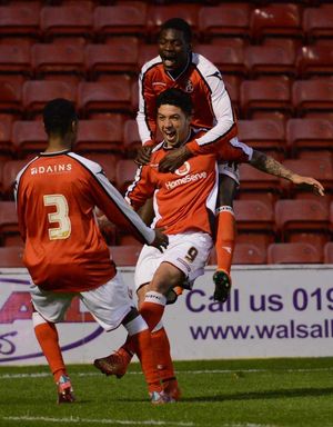 Jordan Murphy celebrates one of his two goals in the Walsall Senior Cup.