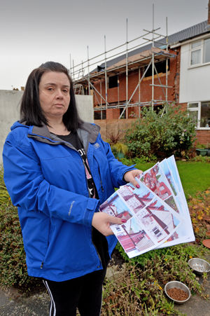 Stacie Elson outside the properties before the demolition work