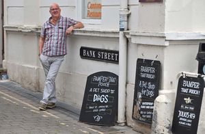 Charlie creates his own signs for the shop