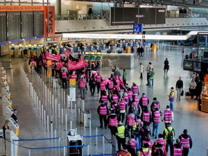 Union members in bright pink on the picket lines