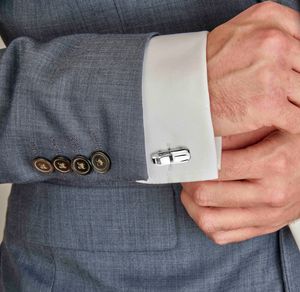 The cufflinks are made from original E-Type parts