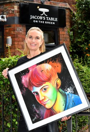 Martel Blackford is the new owner of Jacob's Table cafe, Upper Green, Tettenhall, which she has renamed in memory of her son Jacob Holman, who was tragically killed in a crash. She is pictured holding a painting of her son.