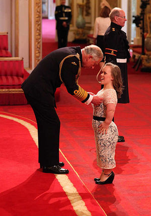 Ellie receives her honour from Prince Charles