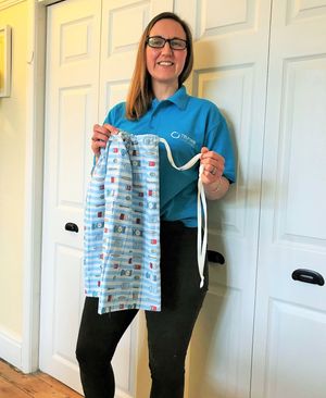 Anna Dowdall with one of the scrub bags being donated
