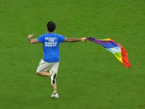Supporting image for story: Qatar pitch invader who carried rainbow flag says he will not face legal action