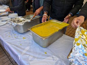 Large vats of vegetarian curry was being provided at one of the stalls