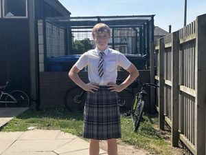 Supporting image for story: Boy goes to school in a skirt in protest at summer shorts ban during heatwave