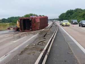 Supporting image for story: Major stretch of M54 shut after lorry transporter hits central reservation barrier and sheds load