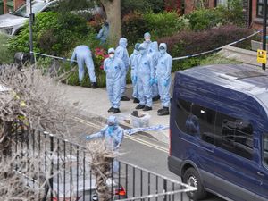 Forensic officers at an address in Shepherd’s Bush, west London, after human remains were found in two suitcases near the Clifton Suspension Bridge in Bristol