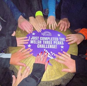 The team leave their mark on top of Snowdon after completing the Welsh three peaks