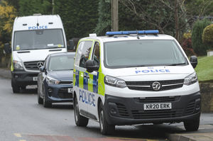 Police cars on Manor Lane, where the house has been cordoned off. Photo: SnapperSK