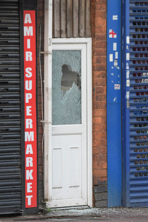 A shattered glass panel in a door. Photo: SnapperSK.