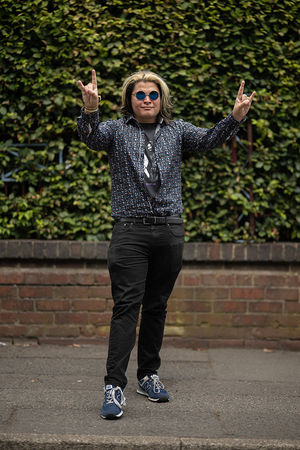 Music fan Eddie Min arrives to attend British rock band Black Sabbath's "Back to The Beginning" concert, Ozzy Osbourne's final ever gig as Black Sabbath's frontman at Villa Park in Birmingham, central England on July 5, 2025. Osbourne, who revealed in 2020 that he has Parkinson's disease, will join Tony Iommi, Geezer Butler and Bill Ward for the all-day "Back To The Beginning" show in Birmingham, central England, where the heavy metal giants formed in 1968. (Photo by Oli SCARFF / AFP) (Photo by OLI SCARFF/AFP via Getty Images)          