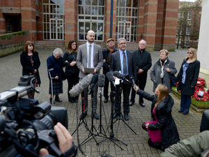 Speaking: Wayne Owen (left) and Neil Craig (right) from the HSE with family members in the back ground