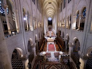 Supporting image for story: Bishop’s three knocks signify reopening of Notre Dame five years after blaze