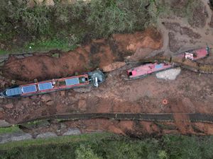 Supporting image for story: Shropshire canal sinkhole: Dramatic drone footage captures the extent of the huge sinkhole in Whitchurch after 10 people were rescued from boats left stranded