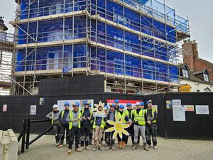 The Pave Aways team outside the refurbishment of the former YMCA building, Wellington