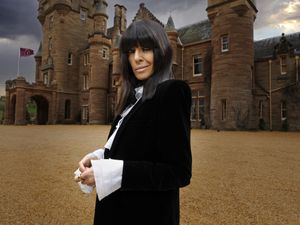 Claudia Winkleman stands outside castle in the Scottish Highlands for the Traitors