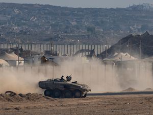 Supporting image for story: Strikes across Gaza kill at least 31 as scholars accuse Israel of genocide