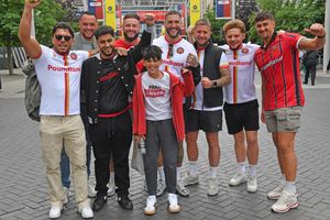 Walsall fans soak up the atmosphere on Wembley way before the kick off of the League Two play-off final