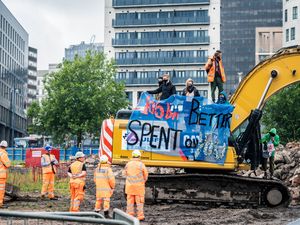 Supporting image for story: Protestors halt work at HS2 site in Birmingham by climbing on digger
