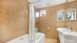 The master bathroom fit with jacuzzi bath and double sink